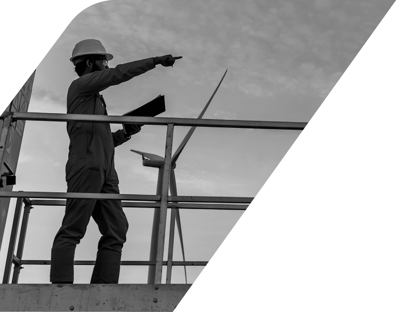 Silhouette of man engineer working and holding the report at wind turbine farm Power Generator Station on mountain,Thailand people